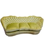 A 20TH CENTURY THREE SEATER SCROLL END SETTEE With serpentine shaped back, in a lime green button