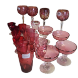 A COLLECTION OF LATE VICTORIAN AND LATER CRANBERRY GLASSWARE Comprising four early Bohemian hook cut