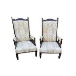 A PAIR OF EDWARDIAN WALNUT OPEN ARMCHAIRS In later floral fabric upholstery, on turned legs. (68cm x