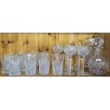 A COLLECTION OF VINTAGE CRYSTAL TUMBLERS AND HOC GLASSES With a matching jug and a decanter,