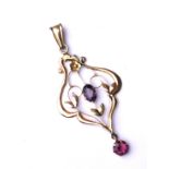 AN ART NOUVEAU ORGANIC FORM 9CT GOLD AND AMETHYST SPHERICAL DROP PENDANT Centred with an oval cut