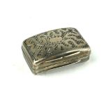 A GEORGIAN SILVER VINAIGRETTE Curved rectangular case with scrolled decoration, pierced gilt