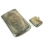 AN EARLY 20TH CENTURY STERLING SILVER RECTANGULAR CARD CASE With engraved oval panel, together