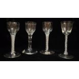 A COLLECTION OF THREE EIGHTEEN CENTURY CORDIAL GLASSES With white air twist stems, together with a