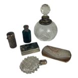 A COLLECTION OF FOUR VARIOUS LATE VICTORIAN SCENT BOTTLES Comprising a hallmarked silver mounted
