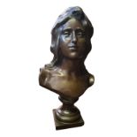 J. OLEST, A LARGE ART NOUVEAU CONTINENTAL SCHOOL PATINATED BRONZE BUST, A YOUNG WOMAN Raised on a