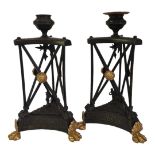 A PAIR OF 19TH CENTURY LOUIS XVI STYLE GILDED BRONZE AND PATINATED METAL TABLE CANDLESTICKS On