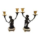 A PAIR OF LATE 19TH/EARLY 20TH CENTURY GILT BRONZE TABLE CANDELABRA Each cast with dark patinated