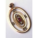 A VICTORIAN 9CT GOLD AND GARNET PENDANT Concentric oval hoops set with a central solitaire