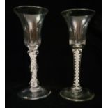 TWO EIGHTEEN CENTURY CORDIAL GLASSES With bell form bowl, one with a double knopped white air