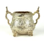 A VICTORIAN SILVER FIGURAL SILVER SUGAR BASIN Twin handled with embossed decoration of a tavern