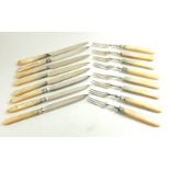 A SET OF SILVER AND MOTHER OF PEARL FRUIT KNIVES AND FORKS Four place setting hallmarked