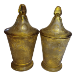 A PAIR OF FINE 19TH CENTURY BOHEMIAN YELLOW AMBER FLASHED COVERED URNS The high dome covers, the
