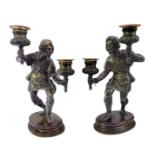 A PAIR OF 19TH CENTURY CAST BRONZE FIGURAL TABLE CANDLEABRUM A pair of dark patinated bronze figures