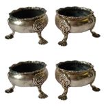 A SET OF FOUR GEORGIAN SILVER SALTS Having a gadrooned design to edge, two hallmarked London 1754,