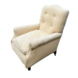 A LATE VICTORIAN EASY ARMCHAIR In pale yellow button back fabric upholstery with loose cushion on