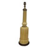 A 20TH CENTURY ART DECO STYLE TALL YELLOW GLAZED GLASS TABLE TOP LAMP BASE Gilt metal mounted. (h