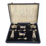 A MID 20TH CENTURY SILVER AND BLUE GLASS CRUET SIX PIECE SET Comprising two salts, two mustard