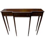 A REGENCY DESIGN MAHOGANY AND SATINWOOD CROSSBANDED BREAKFRONT HALL TABLE Having an arrangement of