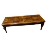 A FIGURED WALNUT COFFEE TABLE. (147cm x 60cm x 42cm) Condition: good overall, some light marks