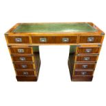 A 19TH CENTURY DESIGN MILITARY/CAMPAIGN YEW WOOD DESK Having a tooled green leather surface and