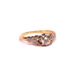 A VINTAGE 18CT GOLD AND DIAMOND SOLITAIRE RING The single round cut diamond in an 18ct gold shank