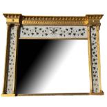 AN ITALIAN MIRROR With reverse glass painted panels decorated with grape vines and trophies, four