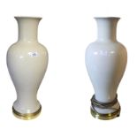 A LARGE PAIR OF BALUSTER POTTERY HALL LAMP BASES Both with gilt metal bases, complete with