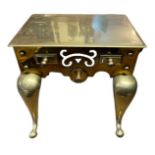 A GEORGIAN BRASS FOOTMAN'S RECTANGULAR TRIVET STOOL With faux drawers and pierced decoration, on