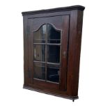 AN 18TH CENTURY OAK WALL HANGING CORNER CABINET With a single glazed door. Condition: good, no