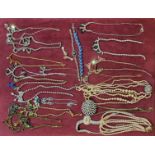 A COLLECTION OF VINTAGE COSTUME JEWELLERY To include diamante necklaces, earrings, a paste set
