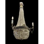 A LARGE EDWARDIAN GILT BRASS AND CRYSTAL SEVEN LIGHT BASKET CHANDELIER The three outer branches