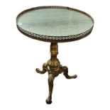 A 19TH CENTURY OCCASIONAL TABLE The brass galleried green marble top on a giltwood base supported on