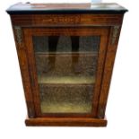 A LATE 19TH CENTURY WALNUT AND MARQUETRY INLAID PIER CABINET With a single glazed door enclosing