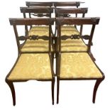 A SET OF SIX REGENCY PERIOD FAUX ROSEWOOD DINING CHAIRS With pierced and carved bar backs and