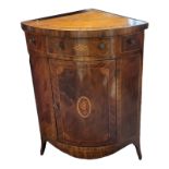 A GEORGIAN MAHOGANY AND MARQUETRY INLAID BOW FRONTED CORNER WASH STAND The removable top enclosing a