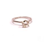 A VINTAGE 18CT WHITE GOLD AND DIAMOND SOLITAIRE RING The single round cut diamond on a plain 18ct