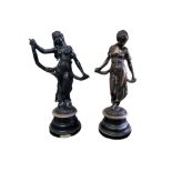 A PAIR OF EARLY 20TH CENTURY CAST IRON STATUES Classical form maidens, titled 'Modestie and