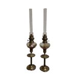 A PAIR OF 19TH CENTURY FRENCH BRASS AND GLASS OIL LAMPS Marked 'Paris'.