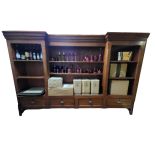 A LARGE 19TH CENTURY GOTHIC MAHOGANY INVERTED BREAKFRONT RECESS BOOKCASE Open shelves with carved