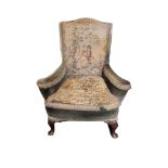 A GEORGIAN DESIGN WING ARMCHAIR In tapestry upholstery, on cabriole legs. (66cm x 64cm x 91cm)