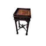 A CHIPPENDALE REVIVAL MAHOGANY OCCASIONAL TABLE With pierced fret work gallery and apron, on cluster