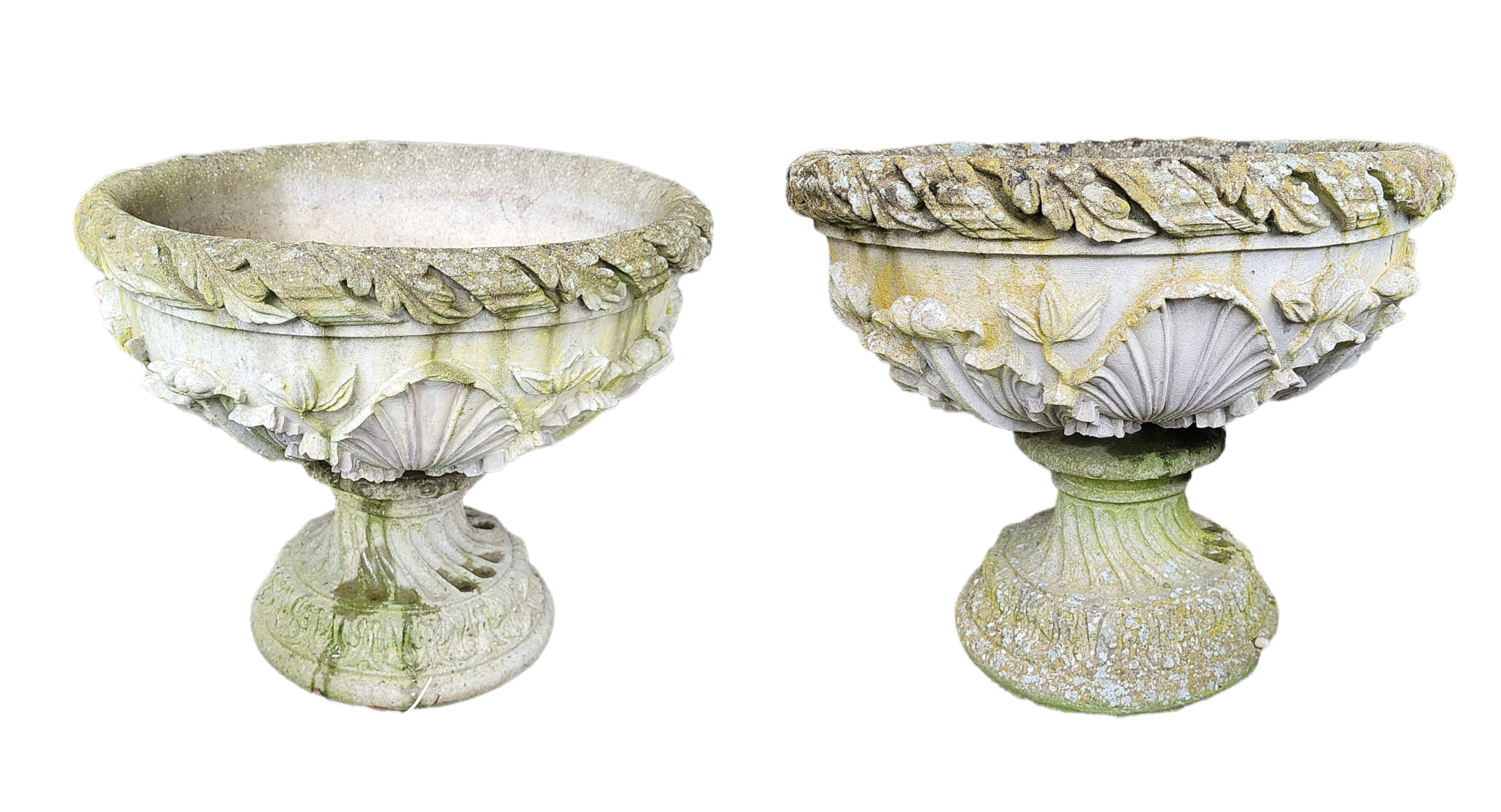 A PAIR OF RECONSTITUTED STONE PLANTERS With shell and leaf decoration. (w 54cm x h 49cm)