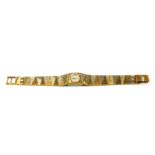 AVIA, A VINTAGE BICOLOUR GOLD PLATES LADIES' WRISTWATCH On an integral bracelet strap, in original