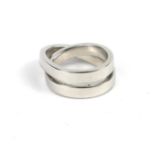 CARTIER, AN 18CT WHITE GOLD NOUVELLE VAGUE RING. (UK size N, 15.3g)