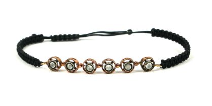 AN 8CT GOLD ROSE CUT DIAMOND BRACELET WITH ROPE MATERIAL CORD. (Diamonds approx. 0.45ct)