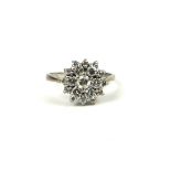 AN 18CT WHITE GOLD AND DIAMOND CLUSTER RING. (total diamond weight 1.02ct, UK size L, gross weight