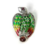 A SILVER EAGLE BROOCH/PENDANT SET WITH RUBY EYE, CABOCHON GARNET AND PLIQUE-A-JOUR.