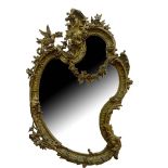 A LARGE EARLY 19TH CENTURY GILTWOOD AND GESSO ROCOCO MIRROR The cartouche form frame decorated