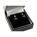 A PAIR OF 9CT WHITE GOLD, BLACK PEARL AND DIAMOND RUBOVER DROP EARRINGS. Boxed